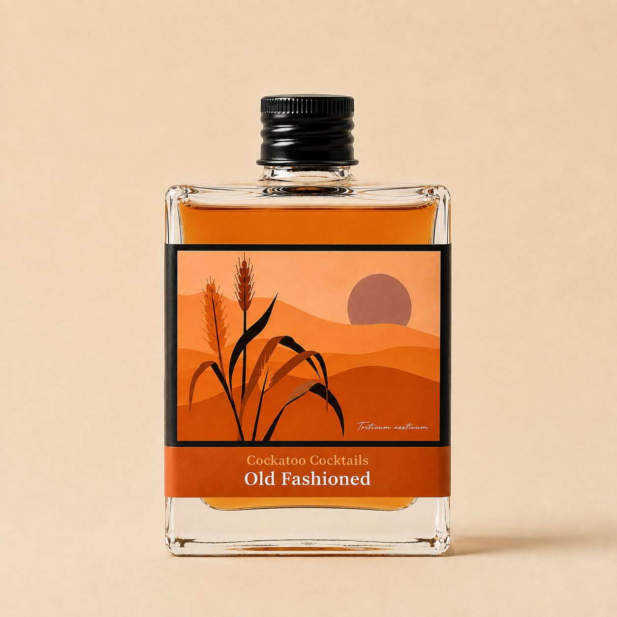 A square glass bottle of Cockatoo Cocktails 'Old Fashioned' with a black cap, filled with amber liquid, set against a solid beige background. The label features an orange and brown desert landscape illustration with wheat stalks.